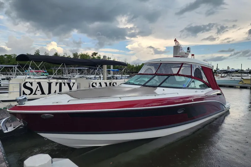 Ship Faced Yacht Photos Pics 2015 Formula 350 Crossover Bowrider docked at marina under cloudy sky.