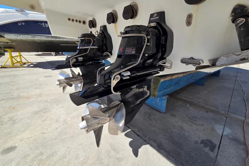 Ship Faced Yacht Photos Pics 2015 Formula 350 Crossover Bowrider with dual Mercury outdrives in a boatyard setting.