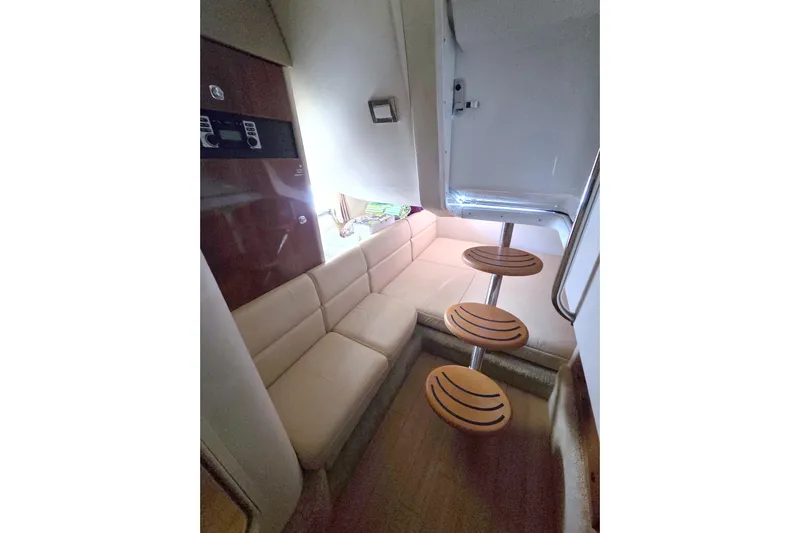 Ship Faced Yacht Photos Pics Interior of 2015 Formula 350 Crossover Bowrider with beige seating and wooden steps.