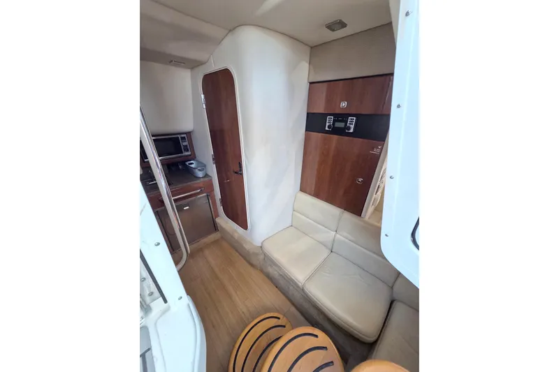 Ship Faced Yacht Photos Pics Interior of 2015 Formula 350 Crossover Bowrider with seating and kitchenette.