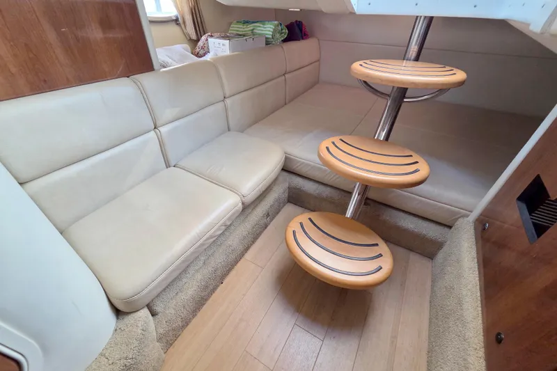 Ship Faced Yacht Photos Pics Interior of 2015 Formula 350 Crossover Bowrider with beige seating and modern spiral staircase.
