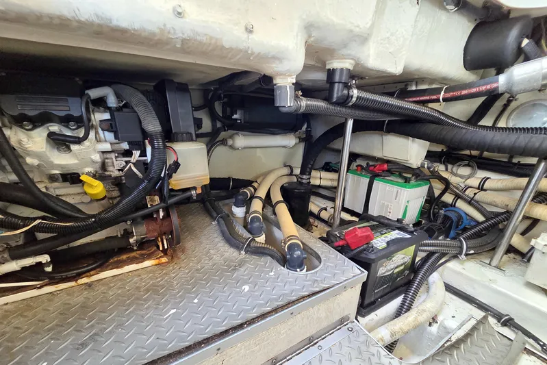 Ship Faced Yacht Photos Pics Engine compartment of a 2015 Formula 350 Crossover Bowrider with visible wiring and battery.