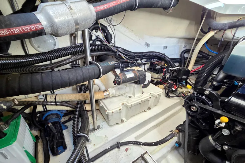 Ship Faced Yacht Photos Pics Engine compartment of a 2015 Formula 350 Crossover Bowrider, showcasing mechanical components and wiring.