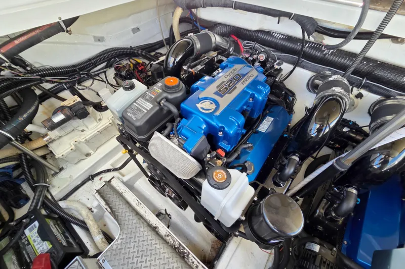 Ship Faced Yacht Photos Pics Engine compartment of a 2015 Formula 350 Crossover Bowrider, featuring a powerful 520 horsepower engine.