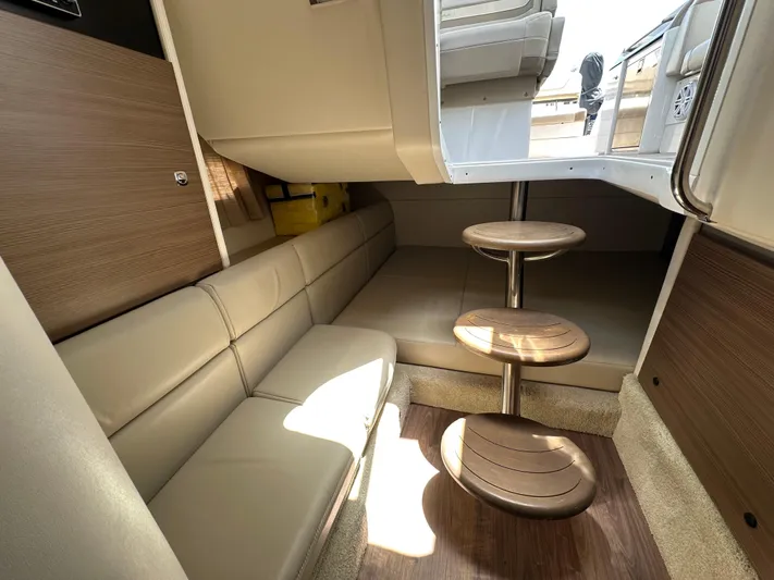  Yacht Photos Pics 2019 Formula 350 Crossover Bowrider interior with beige seating and wooden steps.