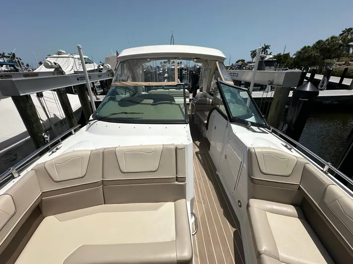  Yacht Photos Pics 2019 Formula 350 Crossover Bowrider at marina, featuring spacious seating and sleek design.