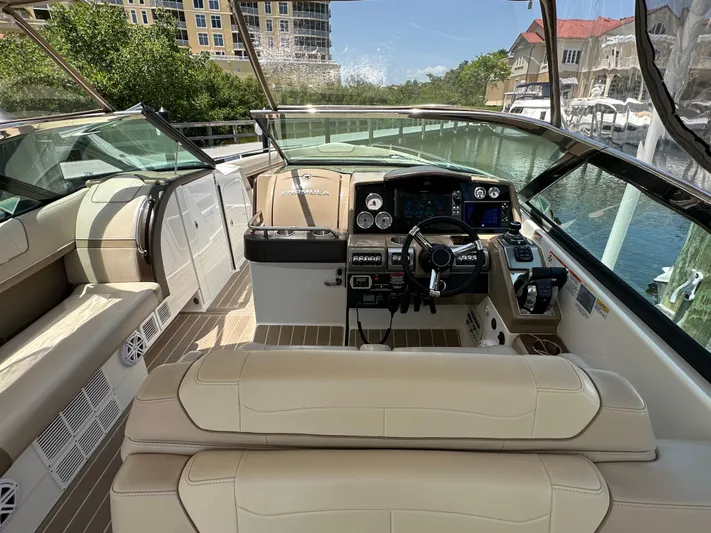  Yacht Photos Pics 2019 Formula 350 Crossover Bowrider interior with beige seating and modern dashboard controls.