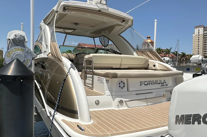  Yacht Photos Pics 2019 Formula 350 Crossover Bowrider docked, showcasing sleek design and spacious seating.