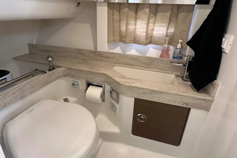  Yacht Photos Pics 2019 Formula 350 Crossover Bowrider bathroom with modern fixtures and sleek design.