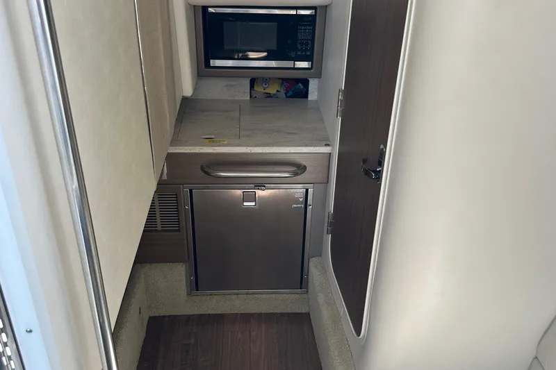  Yacht Photos Pics 2019 Formula 350 Crossover Bowrider interior with microwave and mini fridge.