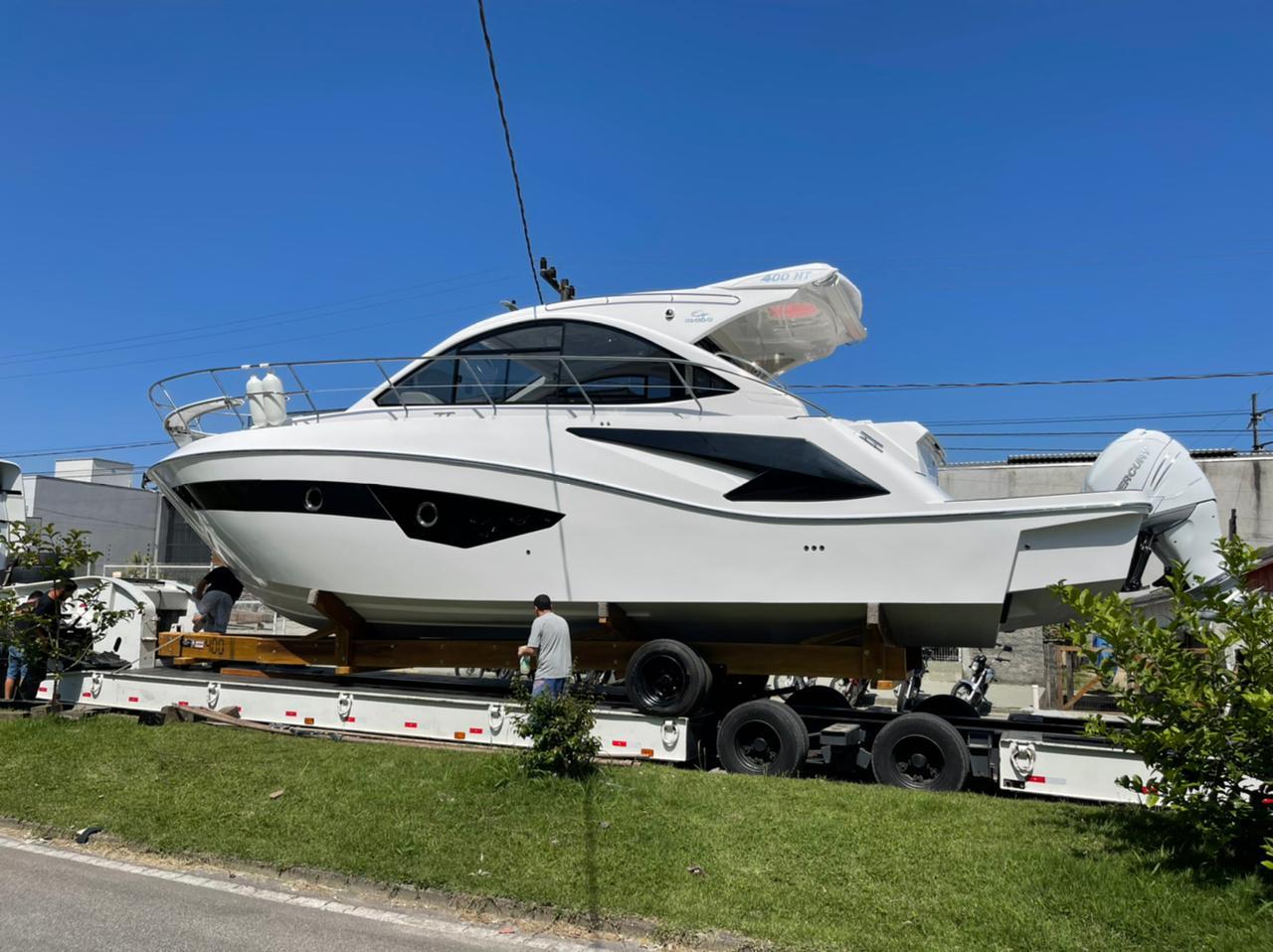 2021 Evolve 400HT yacht on trailer under clear blue sky.
