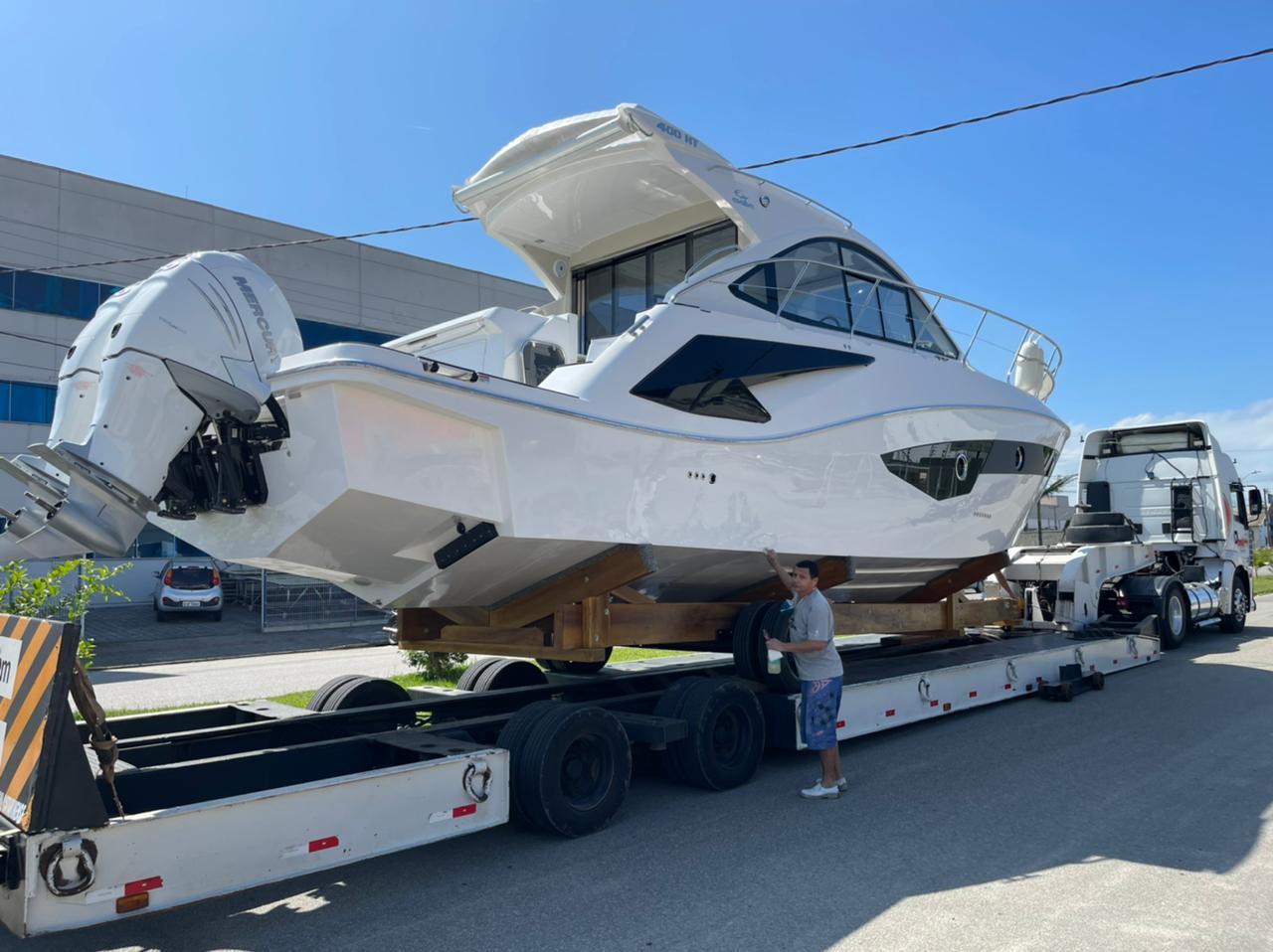 2021 Evolve 400HT yacht on trailer, ready for transport under clear blue sky.