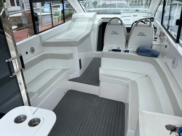 Seas The Moment Yacht Photos Pics Interior of 2021 Evolve 400HT boat with sleek seating and modern design.