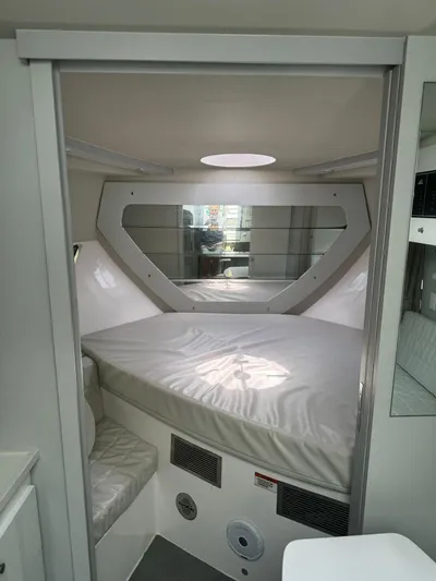 Seas The Moment Yacht Photos Pics 2021 Evolve 400HT interior with modern bed and sleek design.