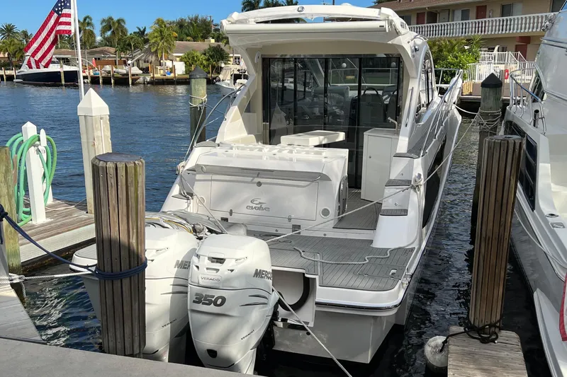 Seas The Moment Yacht Photos Pics Evolve 400HT 2021 boat docked with twin Mercury 350 engines.