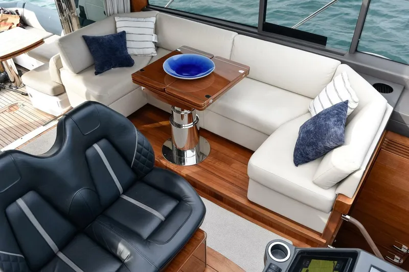  Yacht Photos Pics Luxurious interior of 2022 Princess V50 yacht with plush seating and elegant decor.