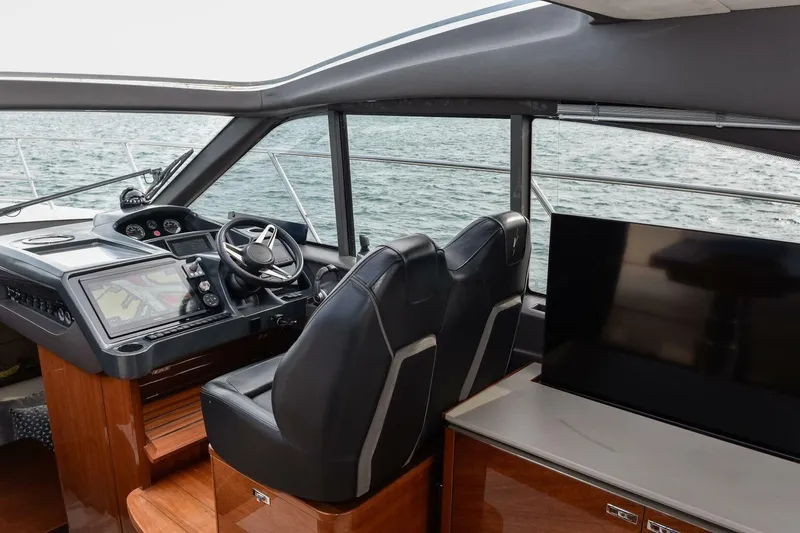  Yacht Photos Pics Interior of 2022 Princess V50 yacht with modern helm and sea view.