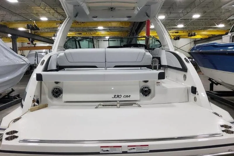 330cbr Yacht Photos Pics Rear view of 2025 Formula 330 Crossover Bowrider I/O in showroom.