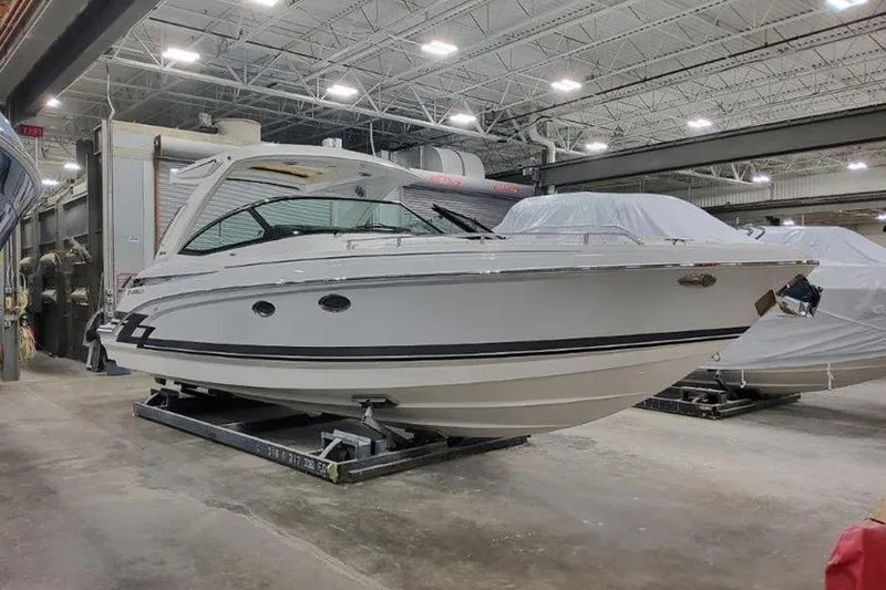 330cbr Yacht Photos Pics 2025 Formula 330 Crossover Bowrider I/O in a boatyard.