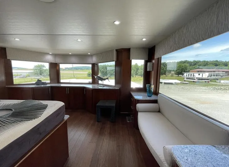  Yacht Photos Pics Luxurious interior of 2015 Stardust Cruisers 20' x 106' houseboat with panoramic windows.