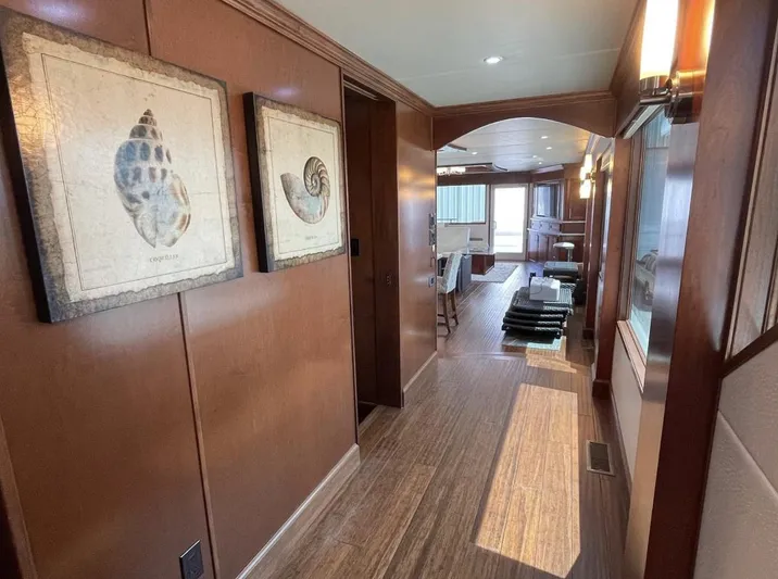  Yacht Photos Pics Luxurious hallway in 2015 Stardust Cruisers 20' x 106' houseboat with wooden decor.