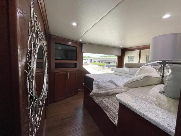  Yacht Photos Pics Luxurious bedroom interior of 2015 Stardust Cruisers 20' x 106' houseboat with modern decor.
