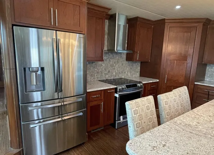 Yacht Photos Pics Modern kitchen in 2015 Stardust Cruisers houseboat with stainless steel appliances and granite countertops.