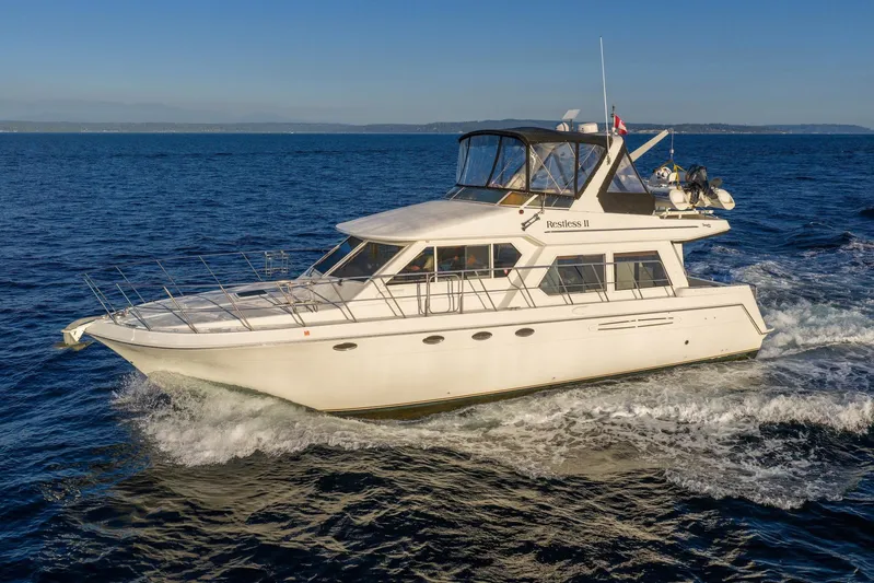 Restless II Yacht Photos Pics Luxury 2007 Navigator Classic 48 yacht cruising on open sea.