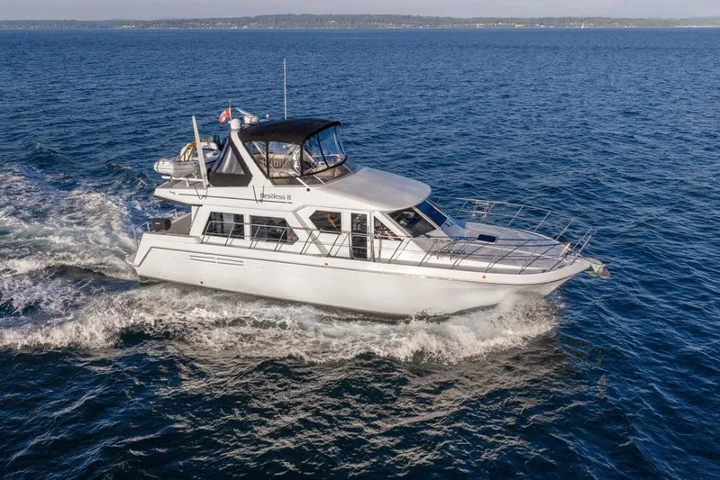 Restless II Yacht Photos Pics 2007 Navigator Classic 48 yacht cruising on open water.