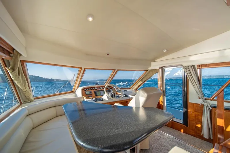 Restless II Yacht Photos Pics Luxurious interior of 2007 Navigator Classic 48 yacht with panoramic ocean views.