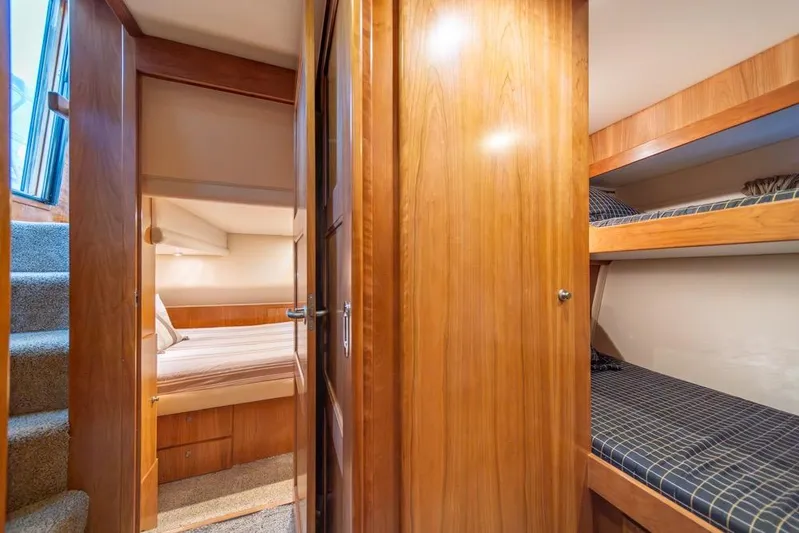 Restless II Yacht Photos Pics Interior of 2007 Navigator Classic 48 yacht with cozy wooden cabin and bunk beds.