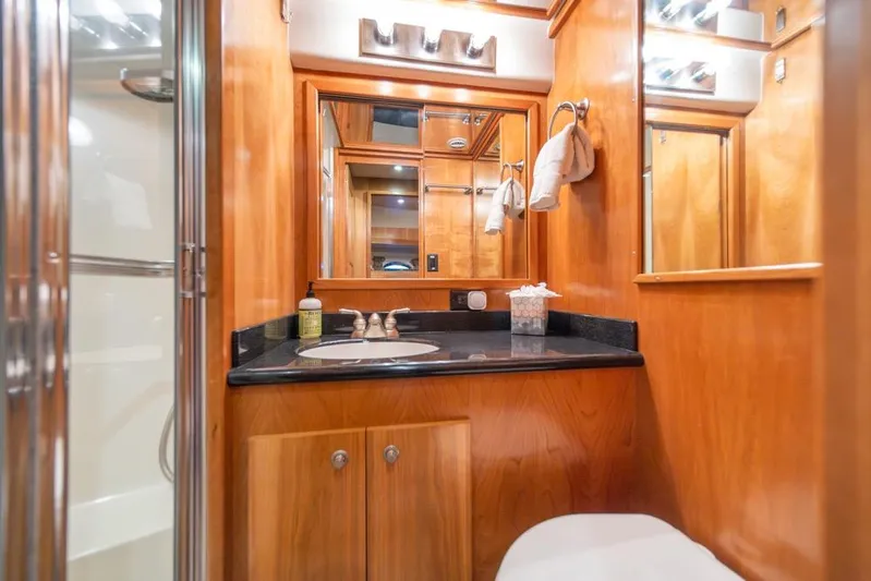 Restless II Yacht Photos Pics Luxurious wooden bathroom interior of 2007 Navigator Classic 48 yacht.