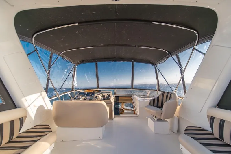 Restless II Yacht Photos Pics Luxurious interior of 2007 Navigator Classic 48 yacht with panoramic ocean views.