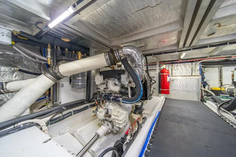 Restless II Yacht Photos Pics Engine room of 2007 Navigator Classic 48 yacht, featuring pipes and machinery.