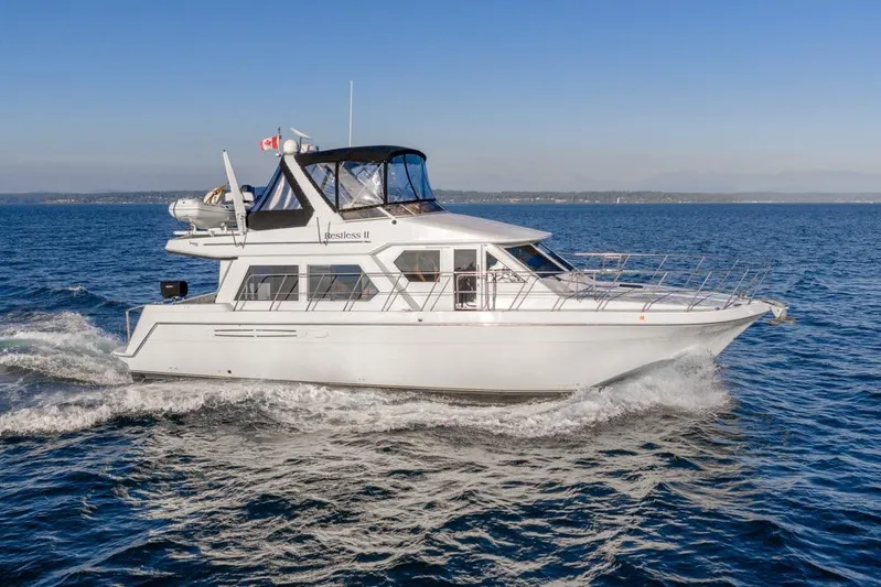 Restless II Yacht Photos Pics 2007 Navigator Classic 48 yacht cruising on open water under clear skies.