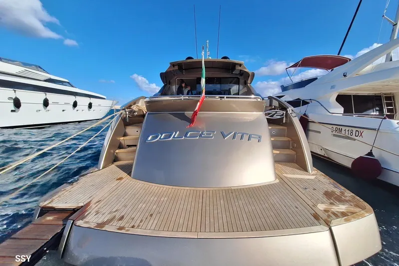  Yacht Photos Pics Luxury 2008 Pershing 72 yacht "Dolce Vita" docked, showcasing sleek design and elegance.