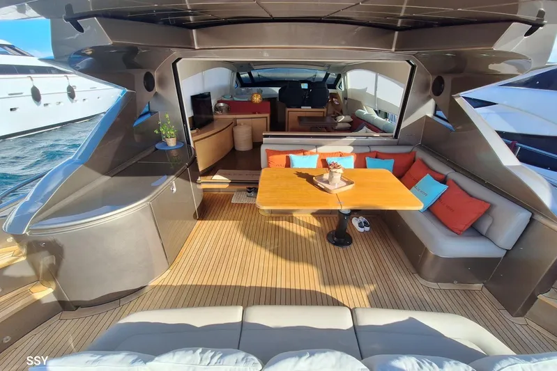  Yacht Photos Pics Luxurious 2008 Pershing 72 yacht interior with elegant seating and wooden table.