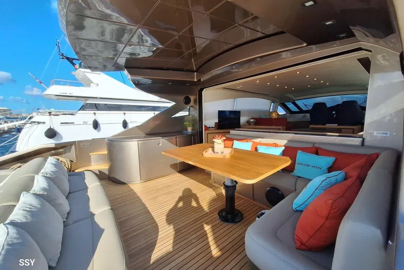  Yacht Photos Pics Luxurious 2008 Pershing 72 yacht interior with elegant seating and dining area.