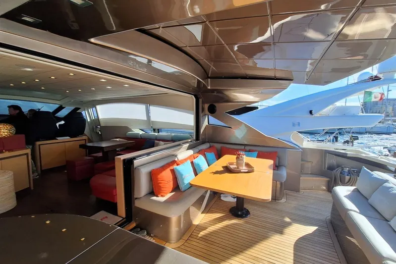  Yacht Photos Pics Luxurious interior of a 2008 Pershing 72 yacht with elegant seating and dining area.