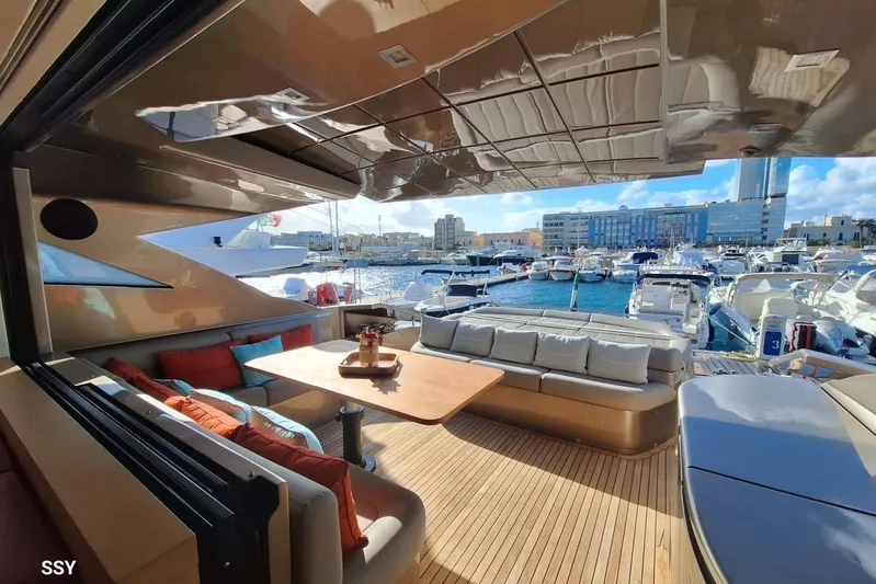  Yacht Photos Pics Luxurious 2008 Pershing 72 yacht interior with marina view, featuring elegant seating and table.