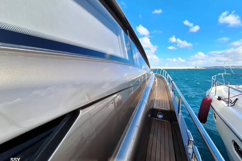  Yacht Photos Pics 2008 Pershing 72 yacht on open sea with clear blue skies.