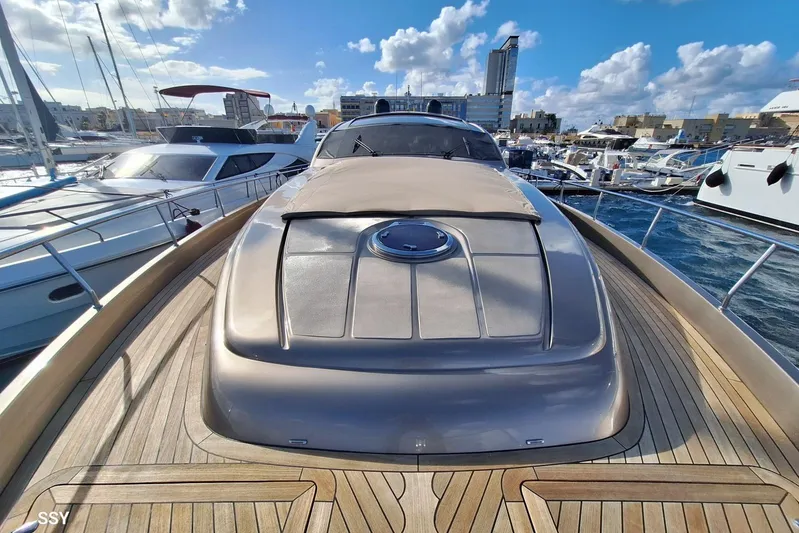  Yacht Photos Pics 2008 Pershing 72 yacht docked in a marina, showcasing sleek design and luxury features.