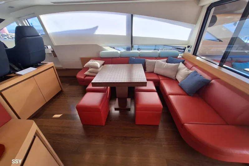  Yacht Photos Pics Luxurious 2008 Pershing 72 yacht interior with red leather seating and modern decor.
