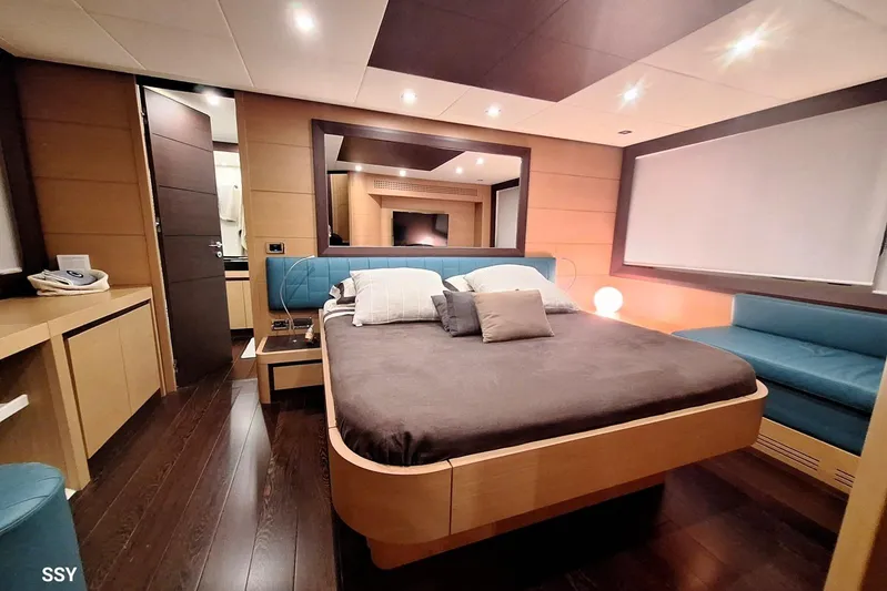  Yacht Photos Pics Luxurious bedroom interior of 2008 Pershing 72 yacht with modern design and cozy ambiance.