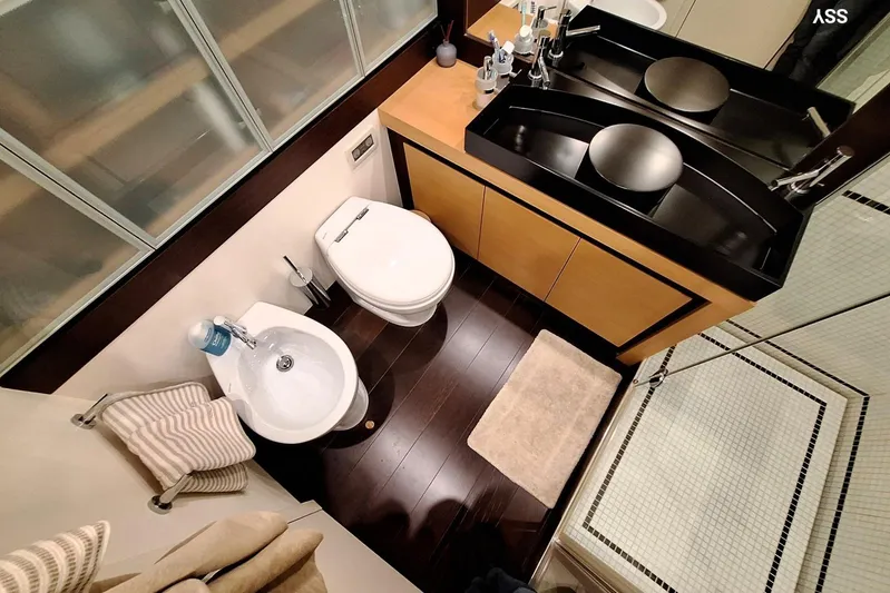  Yacht Photos Pics Luxurious bathroom in 2008 Pershing 72 yacht with modern fixtures and elegant design.