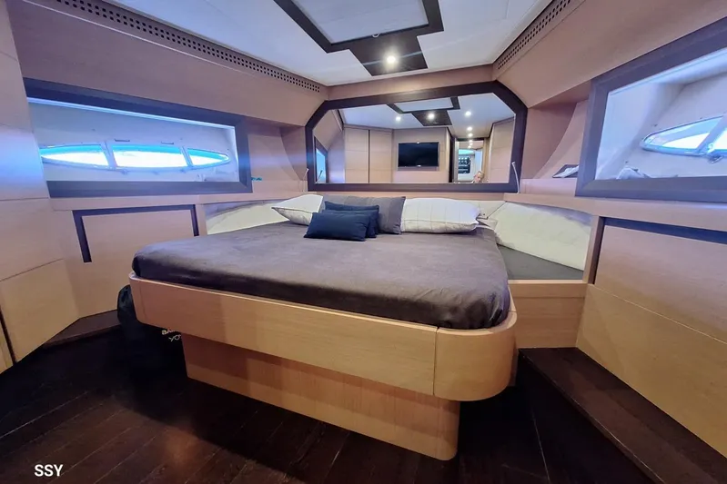  Yacht Photos Pics Luxurious bedroom interior of 2008 Pershing 72 yacht with modern design and cozy bedding.