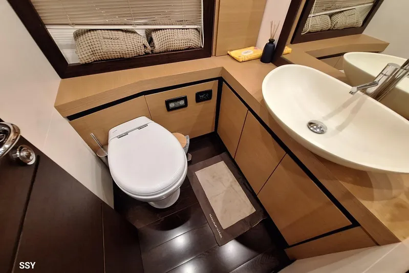  Yacht Photos Pics Luxurious bathroom in 2008 Pershing 72 yacht with modern fixtures and elegant design.