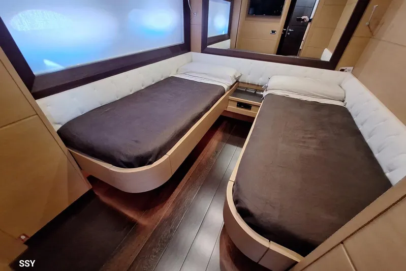  Yacht Photos Pics Luxurious twin bedroom in 2008 Pershing 72 yacht with modern design and wood flooring.