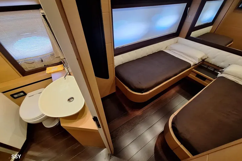  Yacht Photos Pics Luxurious interior of 2008 Pershing 72 yacht with twin beds and ensuite bathroom.