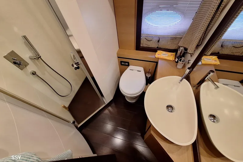  Yacht Photos Pics Luxurious bathroom in 2008 Pershing 72 yacht with modern fixtures and elegant design.